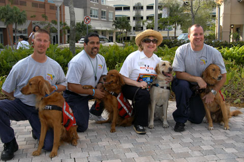 President and CEO Virginia Jacko with Miami-Dade Fire Rescue Search and Rescue Canine Team- Florida Task Force 1