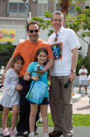 Jason Loeb, Rugsies, and family accept plaque for their Furry Friend Sponsorship