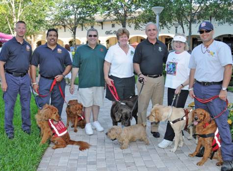 Miami-Dade County Public Defender Carlos Martinez, County Commissioner Sally Heyman, Miami-Dade County Mayor Carlos Gimenez, President and CEO of Miami Lighthouse for the Blind Virginia Jacko with Miami-Dade Fire Rescue Urban Search and Rescue Team.
