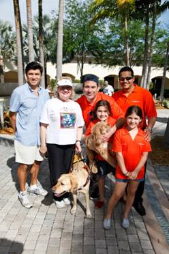 Chairman of the Board Michael Silva, President and CEO Virginia Jacko and Jason Loeb with the Sudsies Family
