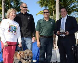 CEO Virginia Jacko, Chairman of the Board Agustin Arellano Jr. with Public Defender Carlos Martinez and Mark Mays of Brickell Motors