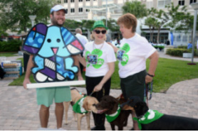 Britto Azul figurine presented to County Commissioner Sally Heyman who collected the most pledges in support of this year’s Dog Walk