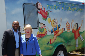 Virginia Jacko, CEO of Miami Lighthouse, gives a tour of the Heiken mobile eye care unit to Commissioner Monestime
