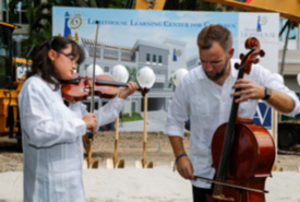 Miami Lighthouse Music Production Program Participant Sofia Causa-Dumay on violin with Robert Saunders, Music Program Manager, on cello