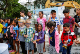 Summer Training and Recreation Program Students sing the National Anthem
