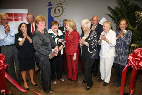 Ribbon cutting celebration: Jan and Daniel Lewis, Agustin Arellano, Sr., Commissioner Sally Heyman, Mrs. Sash A. Spencer, Chair-elect Ray Casas, Virginia Jacko President & CEO, Carmella Witt, Mayor Tomas Regalado, Marta Weeks Wulf and Penny Stamps.