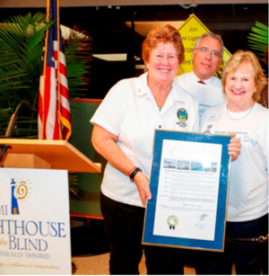 Miami-Dade County Commissioner Sally Heyman presents proclamation to Board Chair Ramon Casas and CEO Virginia Jacko.