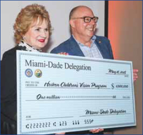 Representative David Richardson, Florida State Health Care Appropriations Democratic Ranking Member, presents check on behalf of Miami-Dade Delegation to President and CEO Virginia Jacko