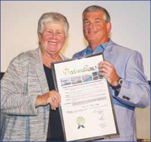 Miami-Dade Commissioner Sally Heyman presents proclamation to honoree Lee R. Stern