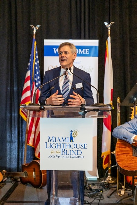 Chair of the Board Steven Solomon welcomes luncheon guests