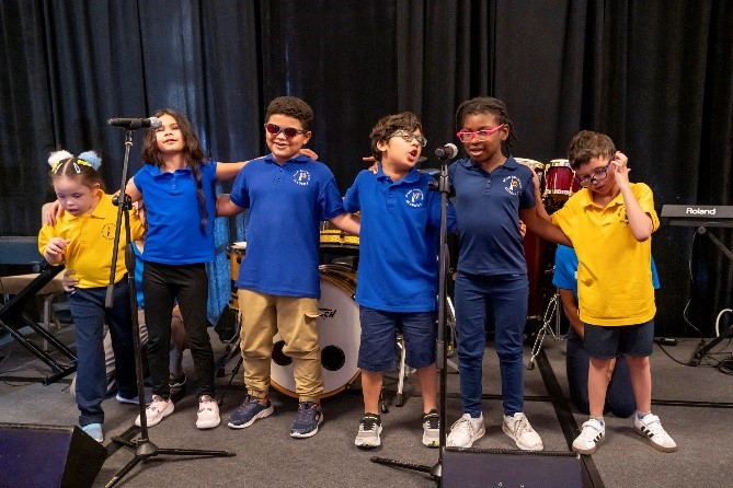 Miami Lighthouse Academy second grade class sings 