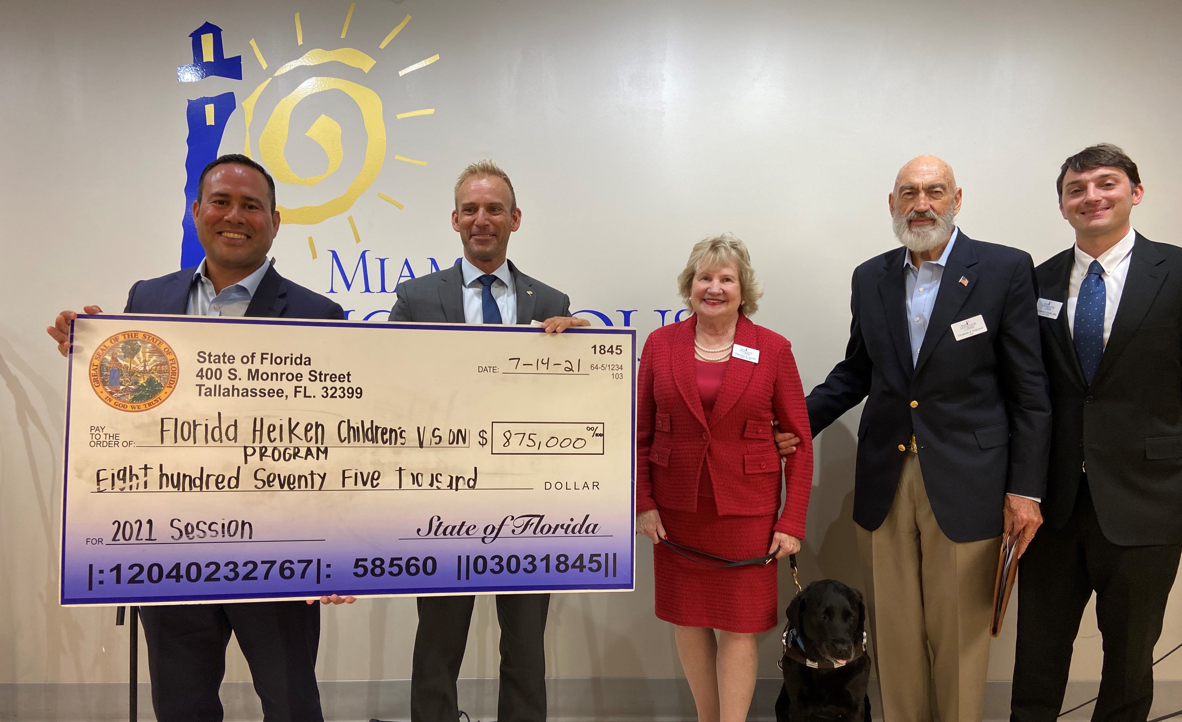 Representative Nicholas Duran and Representative Michael Grieco present check to President and CEO Virginia Jacko, Board Chair Charles Nielson Sr. and YPOL Chair Alexander Nostro.