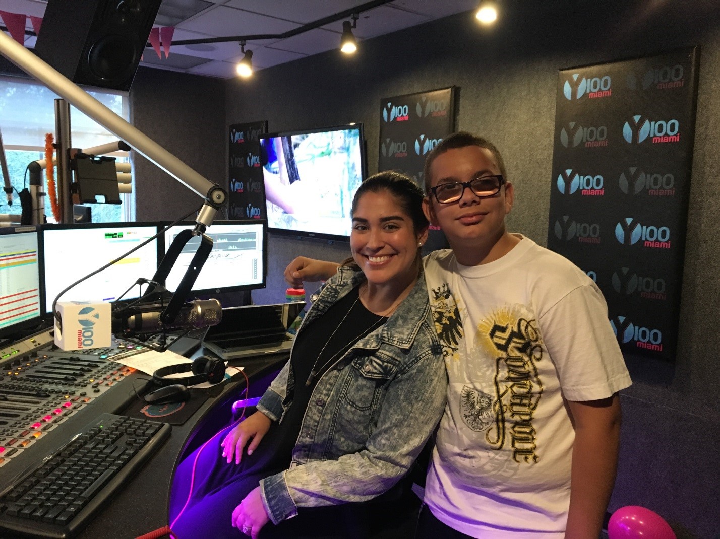 Pre-Employment Transition student Christian with Michelle Fay during a visit to Y100 Miami