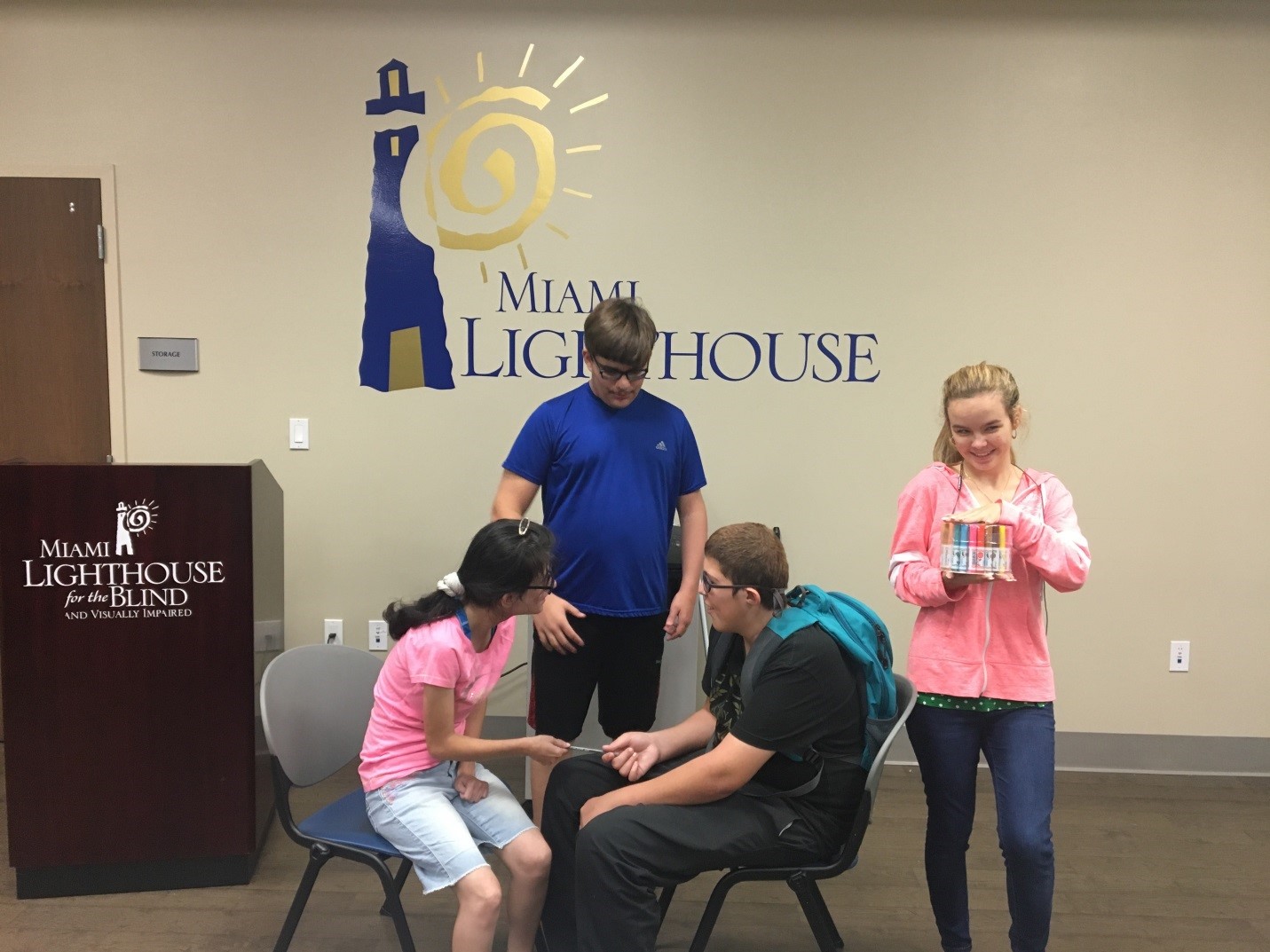 Four Pre-Employment Transition Services students engaged in a role playing activity