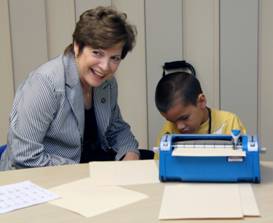 Senator Nan Rich visits the STAR summer camp program Braille literacy class.