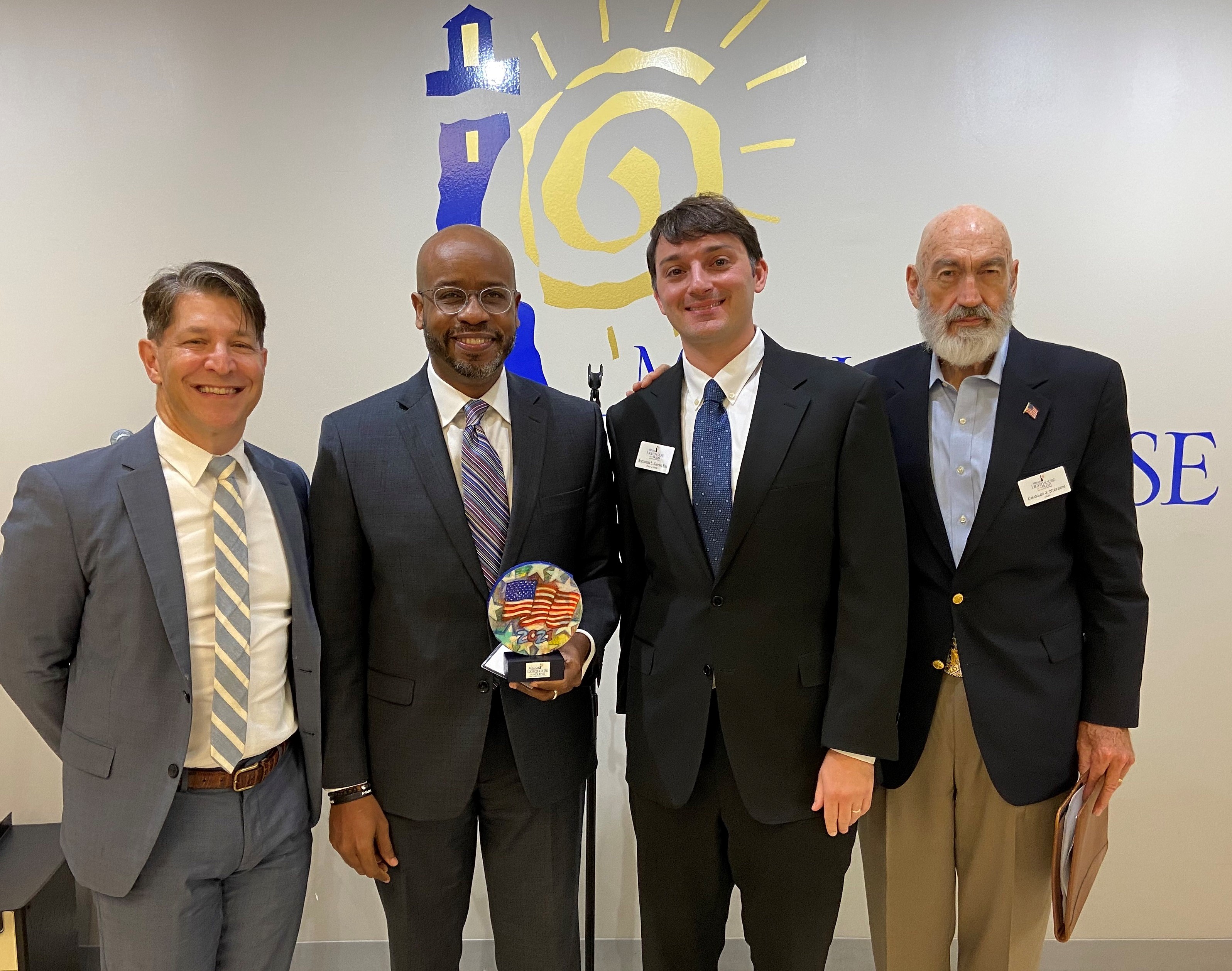 Event sponsors Mitchell Bierman and Marlon Hill from Weiss Serota Helfman Cole & Bierman presented with handmade plaque by YPOL Chair Alexander Nostro and Board Chair Charles Nielson Sr.